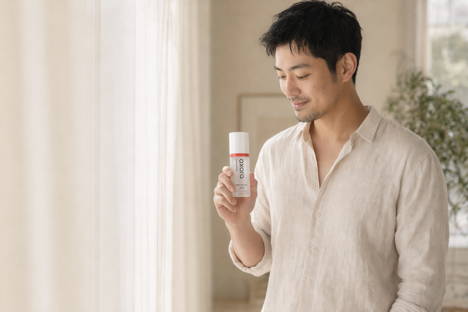 A man holding Oxora Acne-prone by a sunlit window